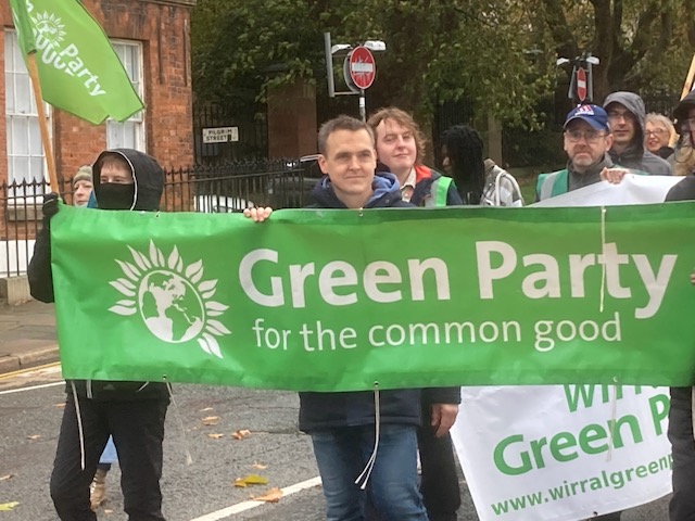 Councillor Tom Crone with Green Party banner
