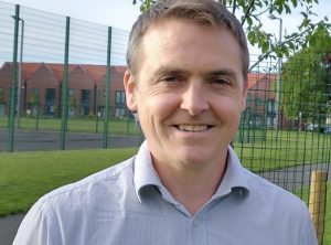 Councillor Tom Crone in blue shirt